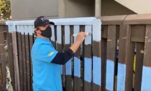 Lowe's volunteers painting the playground mural on October 5th, 2021